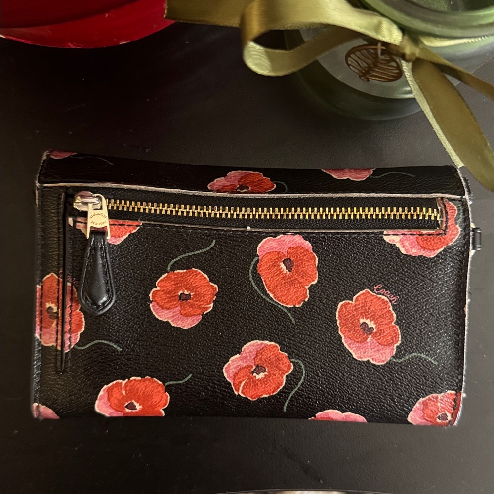 COACH bifold wallet with cute poppy print. Change pocket in back. Snap closure. - Picture 12 of 16